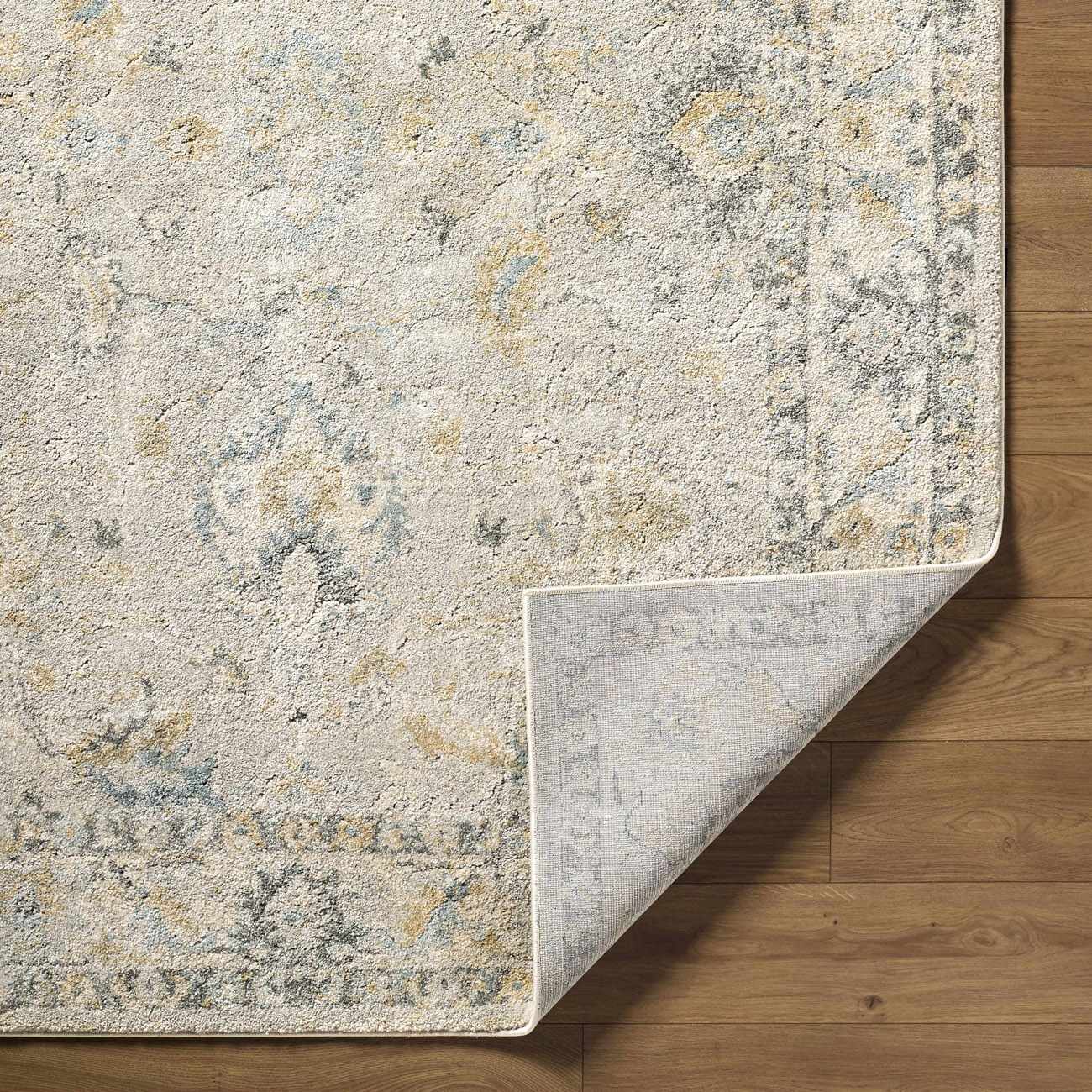 Textured area rug on a wooden floor