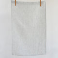 Soft neutral striped linen tea towel with minimalist European-inspired styling and timeless natural
