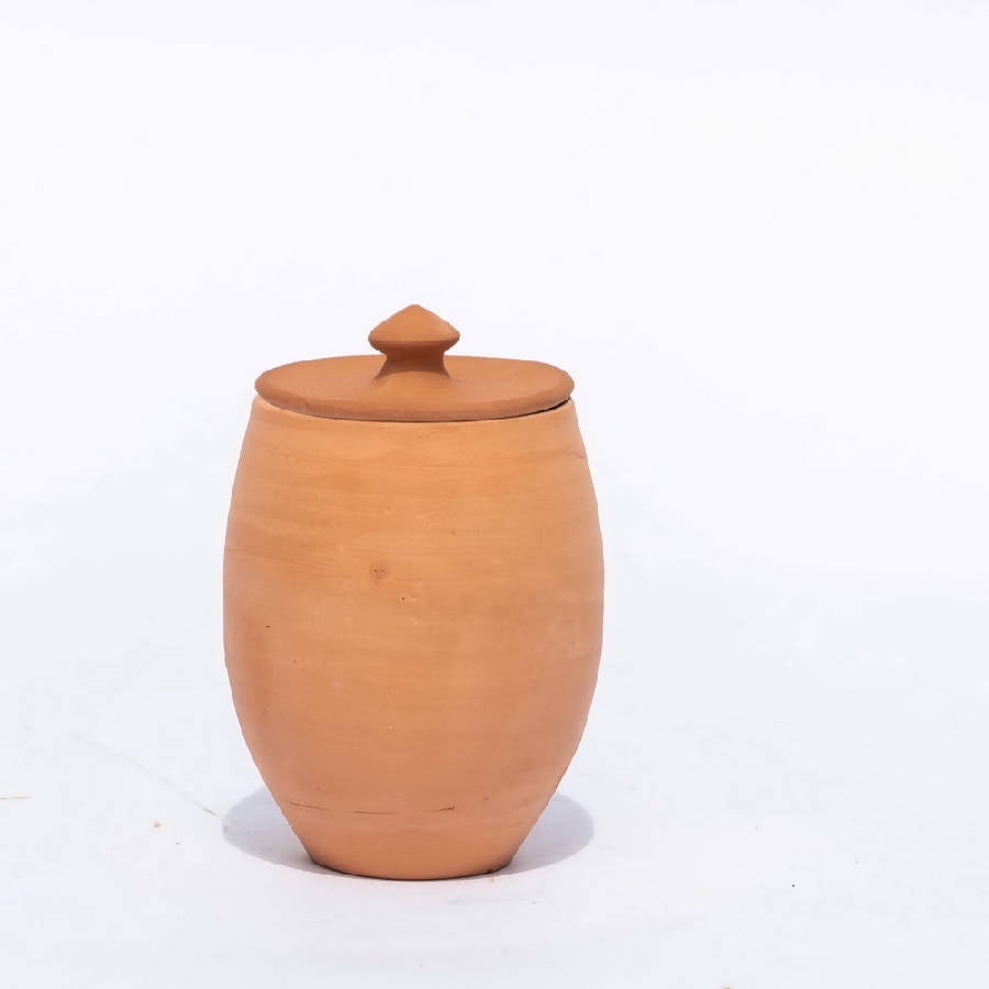 Rustic handcrafted terracotta storage vessel with rounded silhouette and natural clay texture in a warm neutral palette | Sorelle Rossi Shoppe