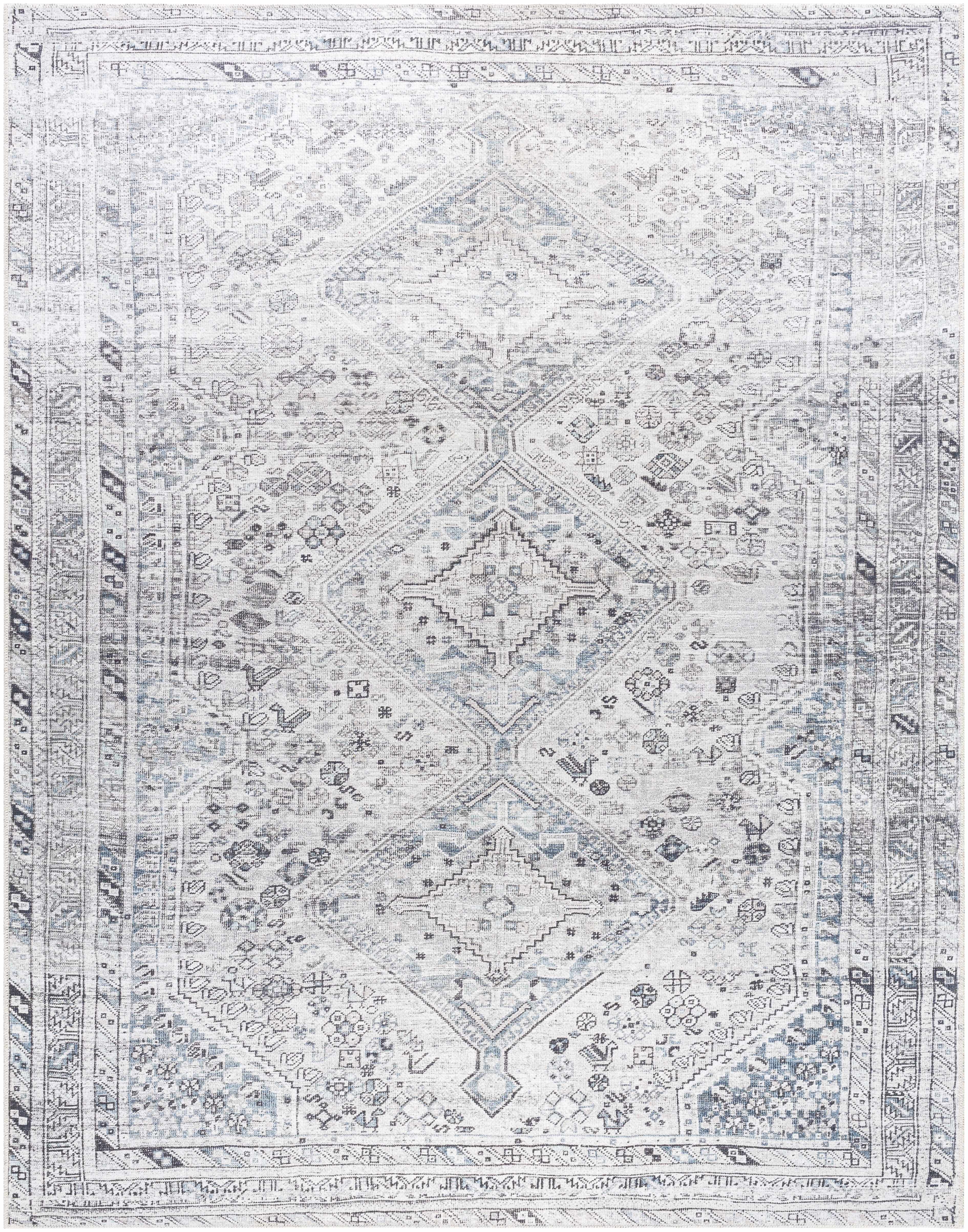 Patterned rug with geometric design in gray and white