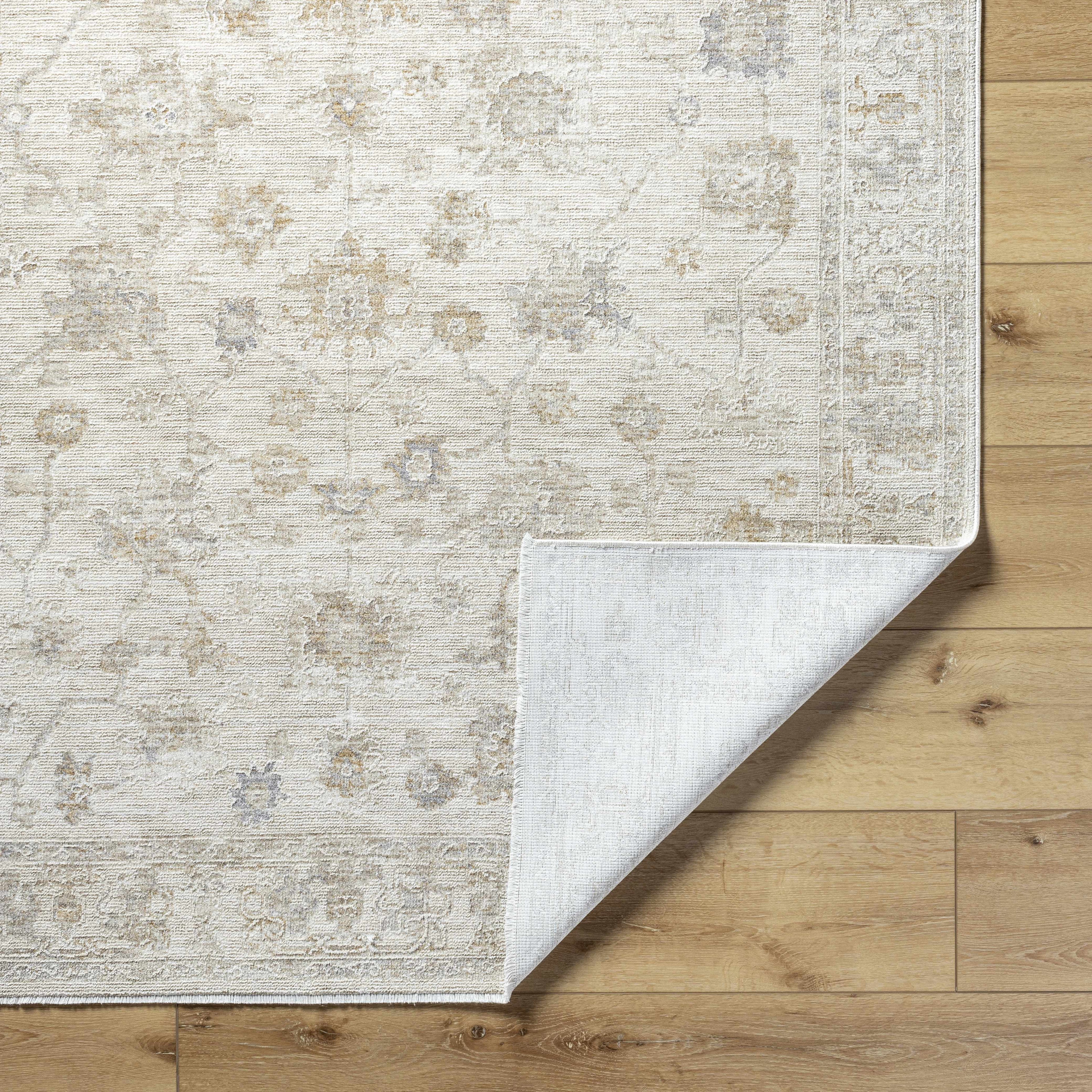 Patterned rug on a wooden floor