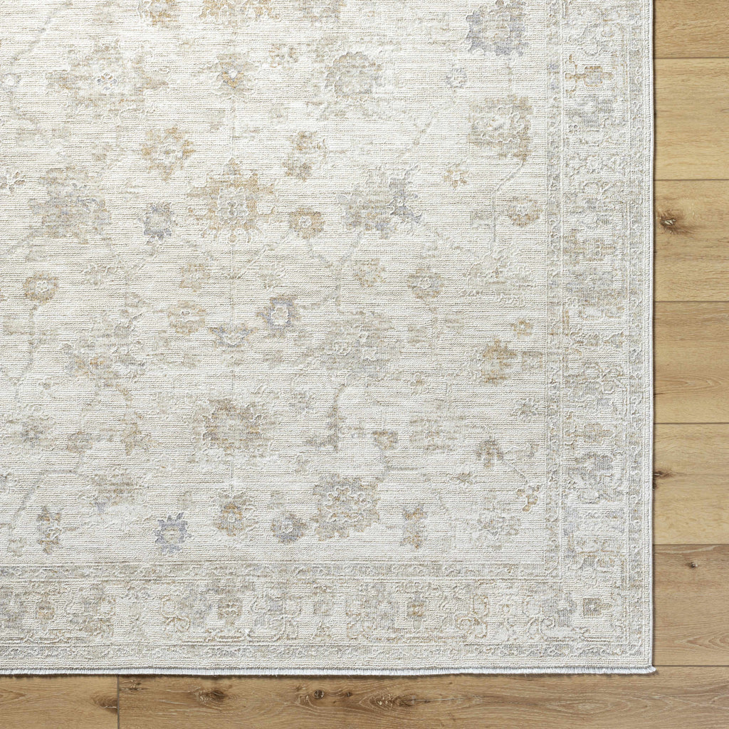 Patterned rug on a wooden floor