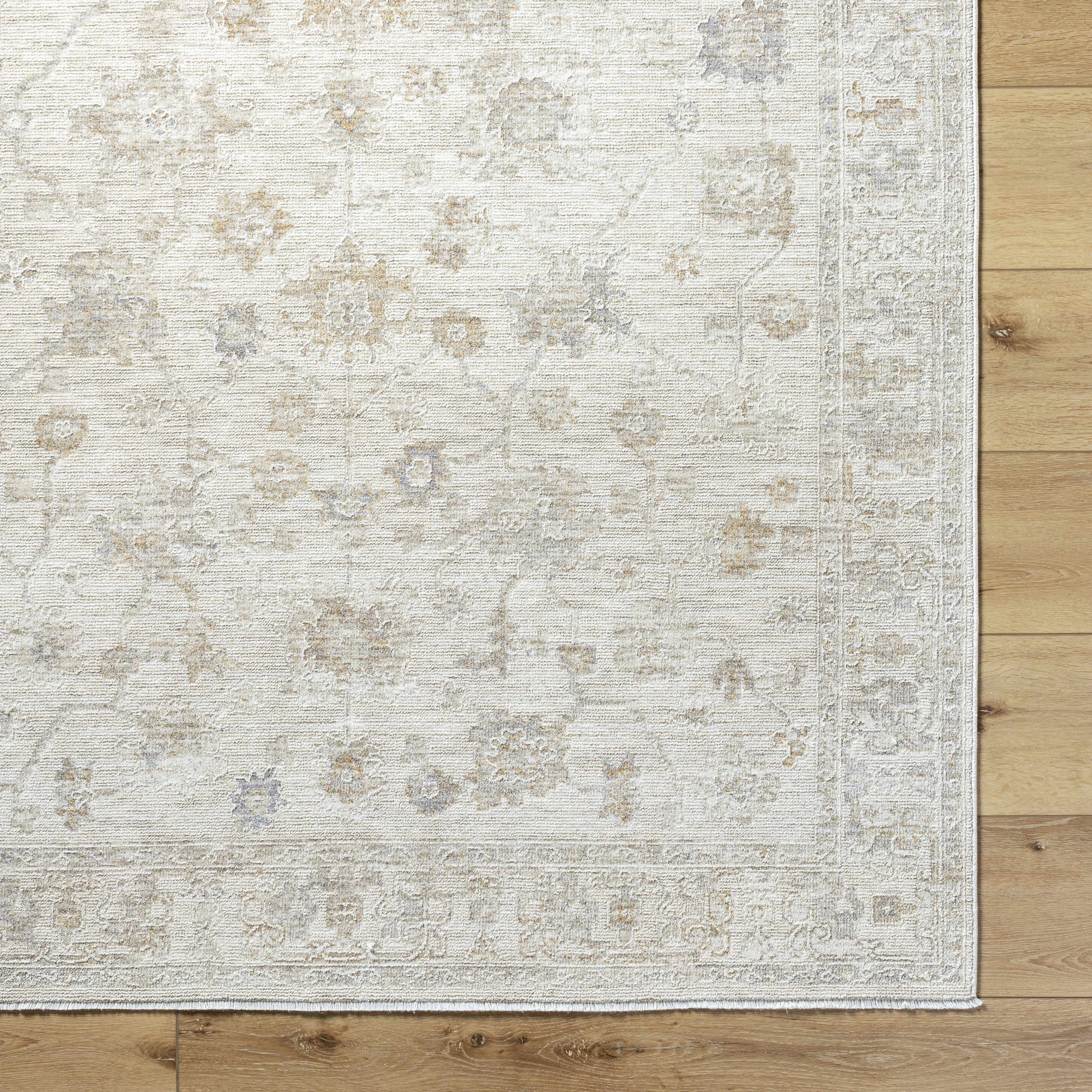 Patterned rug on a wooden floor