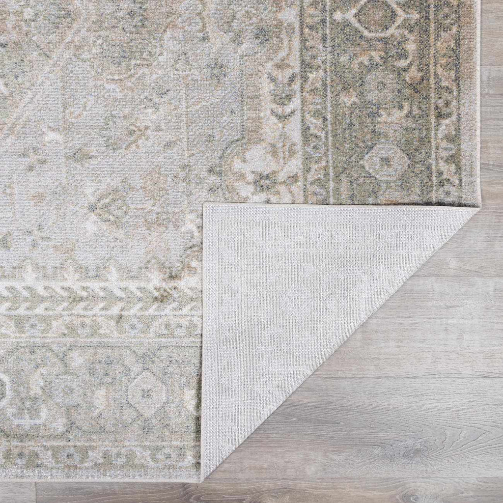 Patterned rug on a wooden floor
