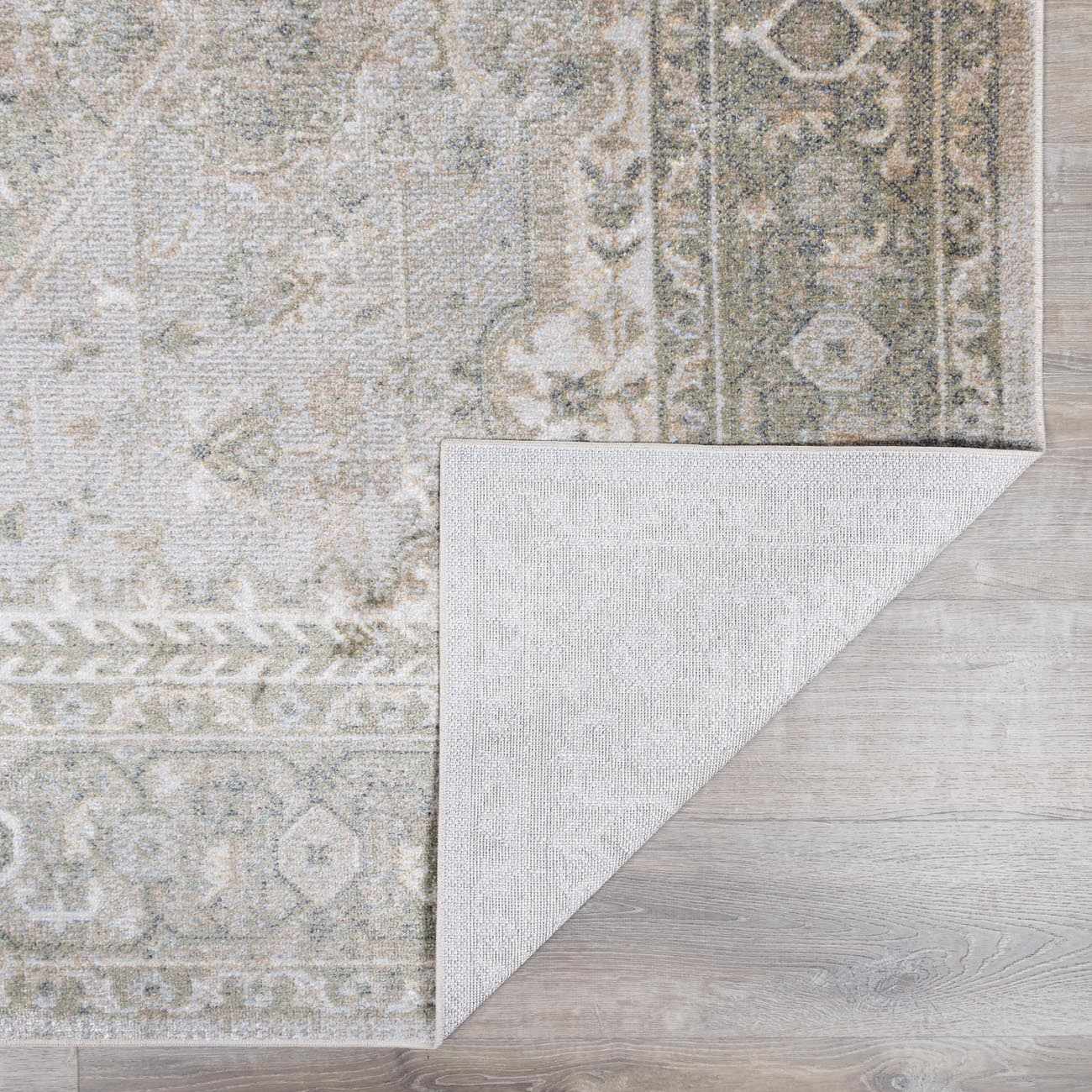 Patterned rug on a wooden floor