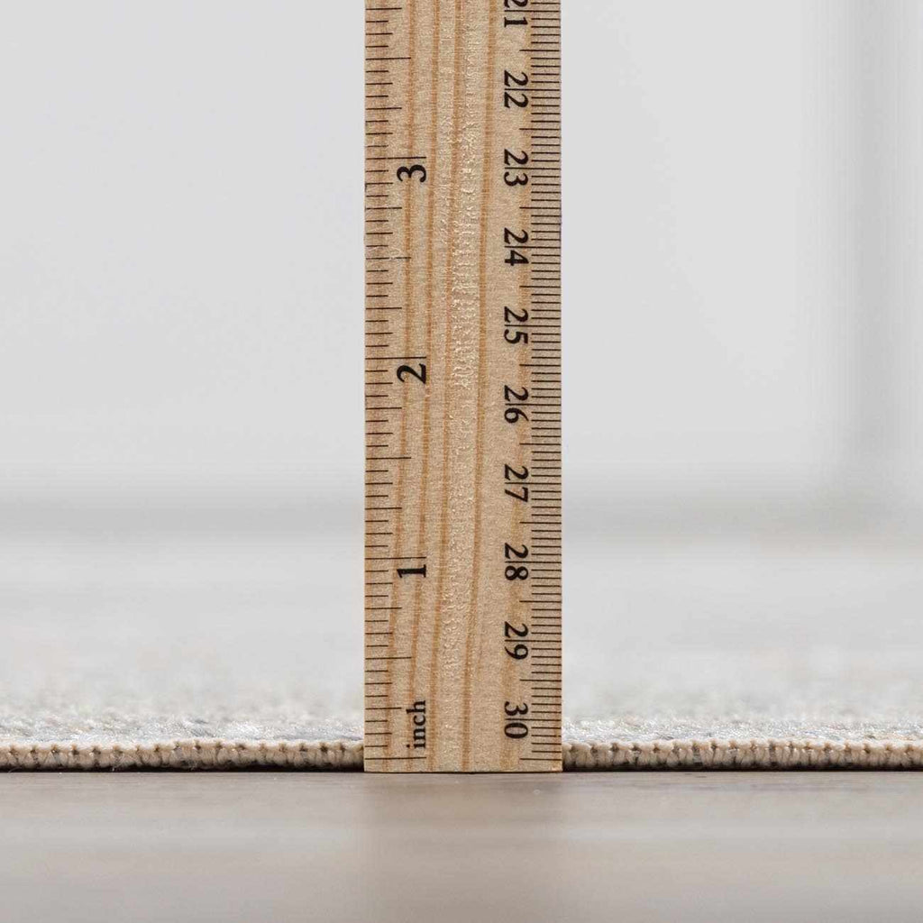 Wooden ruler on a textured white surface