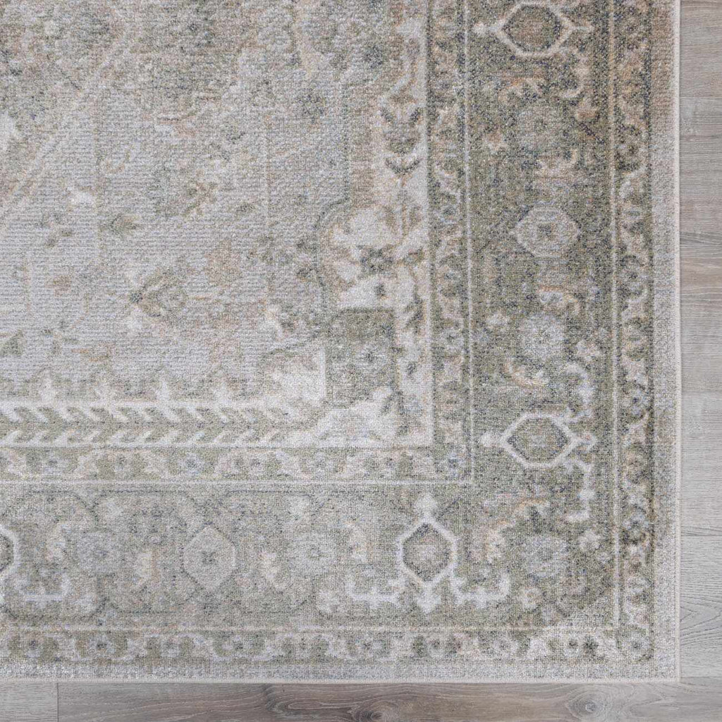 Patterned rug on a wooden floor