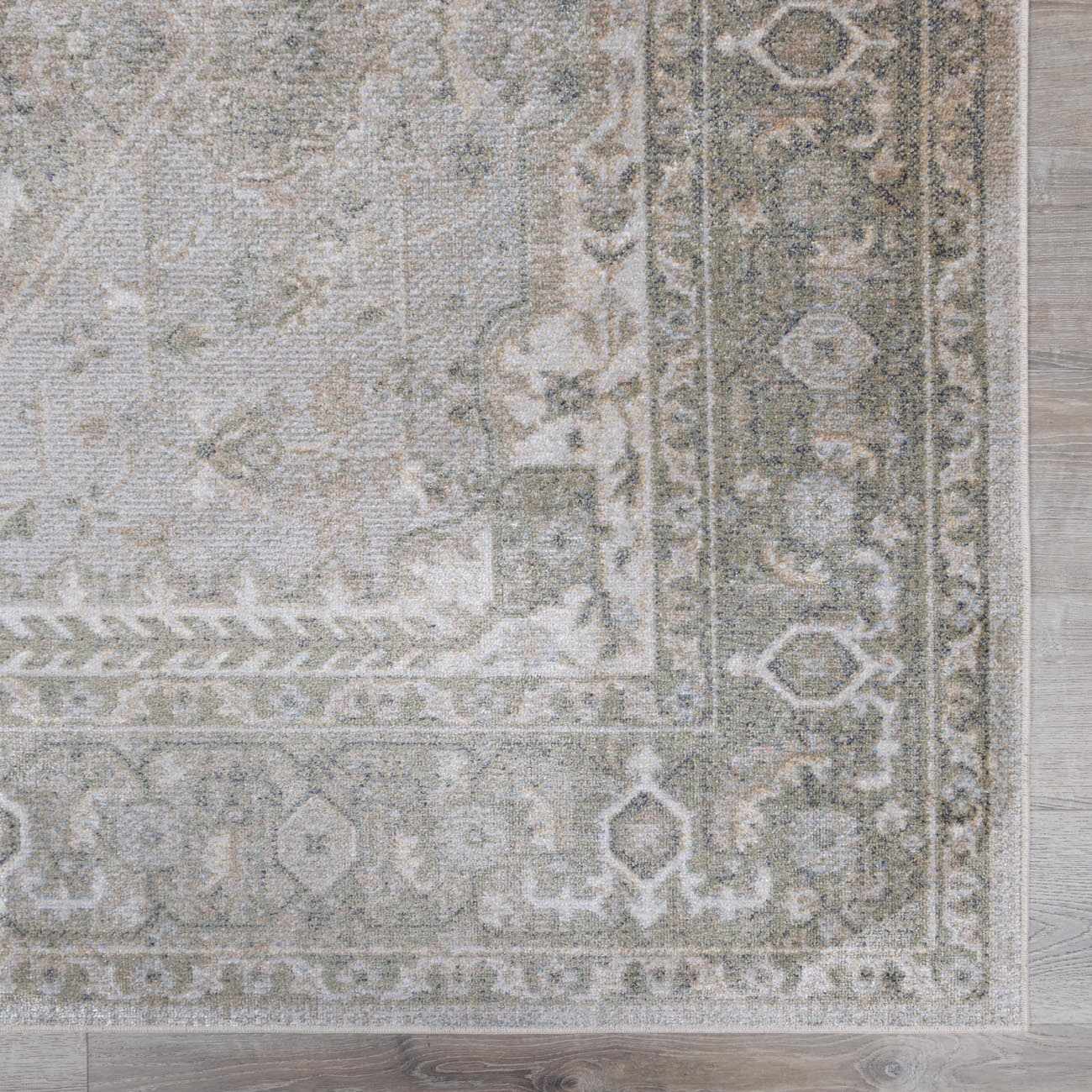 Patterned rug on a wooden floor