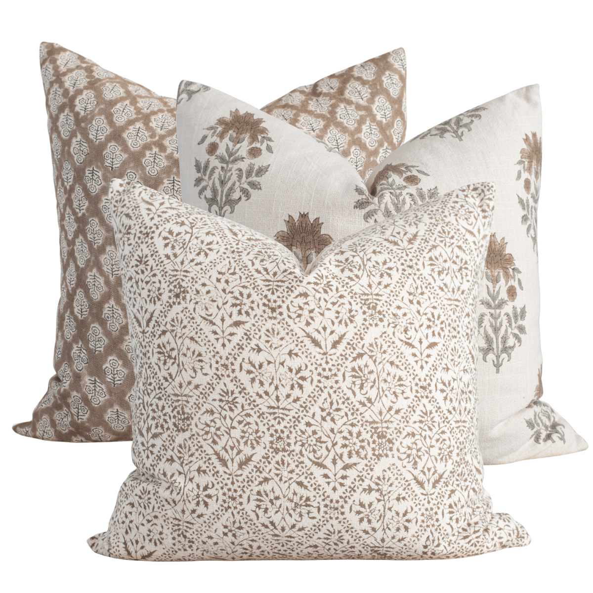 Set of four patterned pillows on a white background