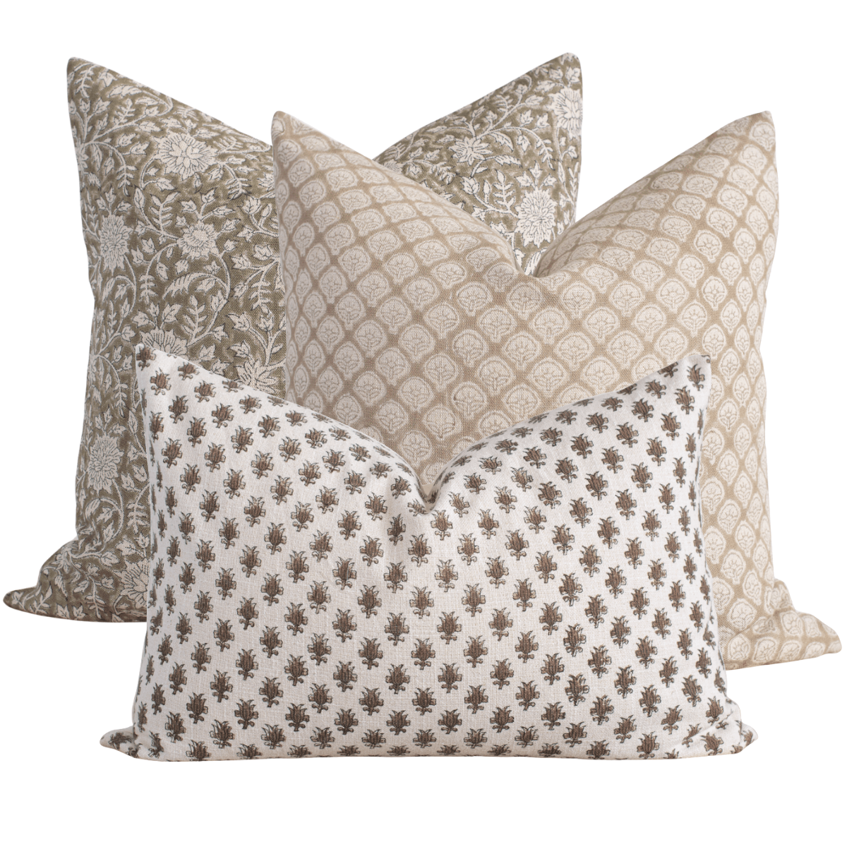 Four patterned pillows on a white background