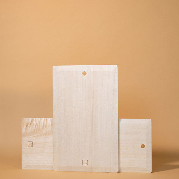 Neutral natural wood serving board with a sleek handcrafted silhouette for elevated kitchen decor | Sorelle Rossi Shoppe