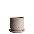 Handmade ceramic planter in warm taupe with matte textured finish