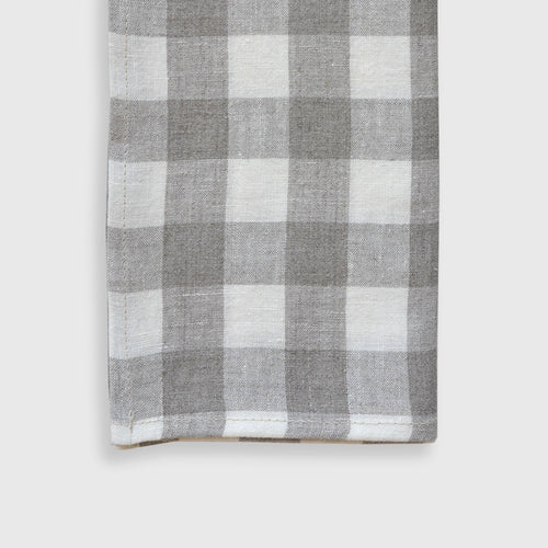 Gray and white checkered towel on a white background