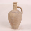 Terracotta jar with a handle on a white background
