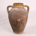 Brown ceramic jar with handles on a white background