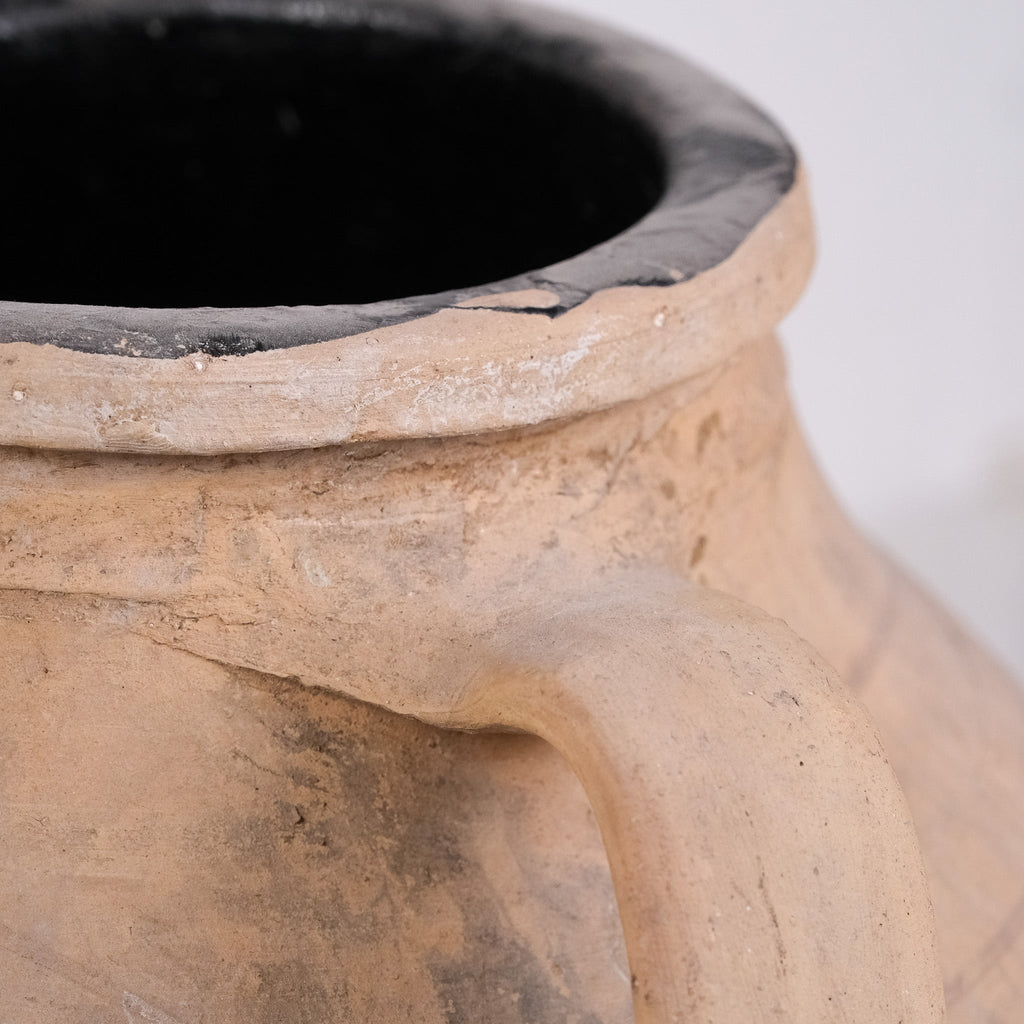 Close-up of a terracotta pot with a dark interior