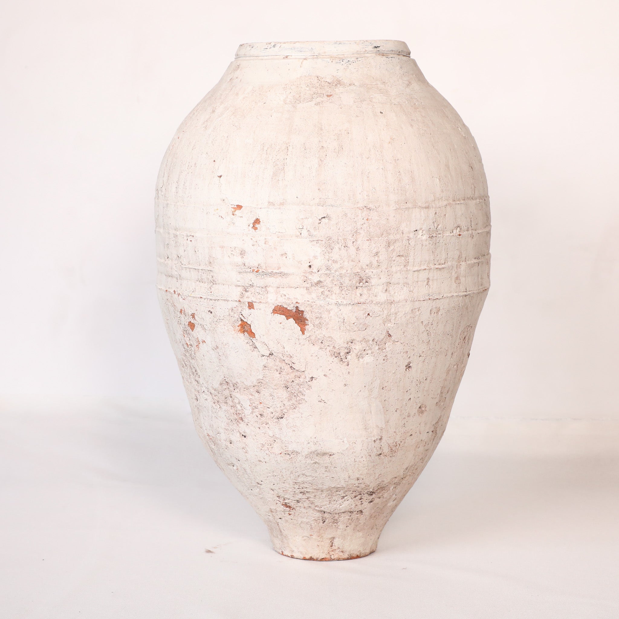 White ceramic vase on a white background