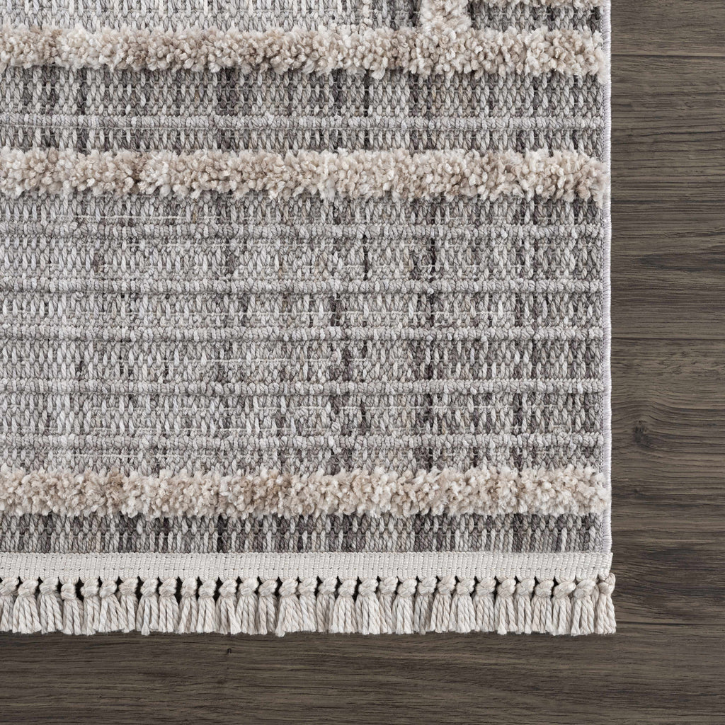 Textured area rug with striped pattern on a wooden floor
