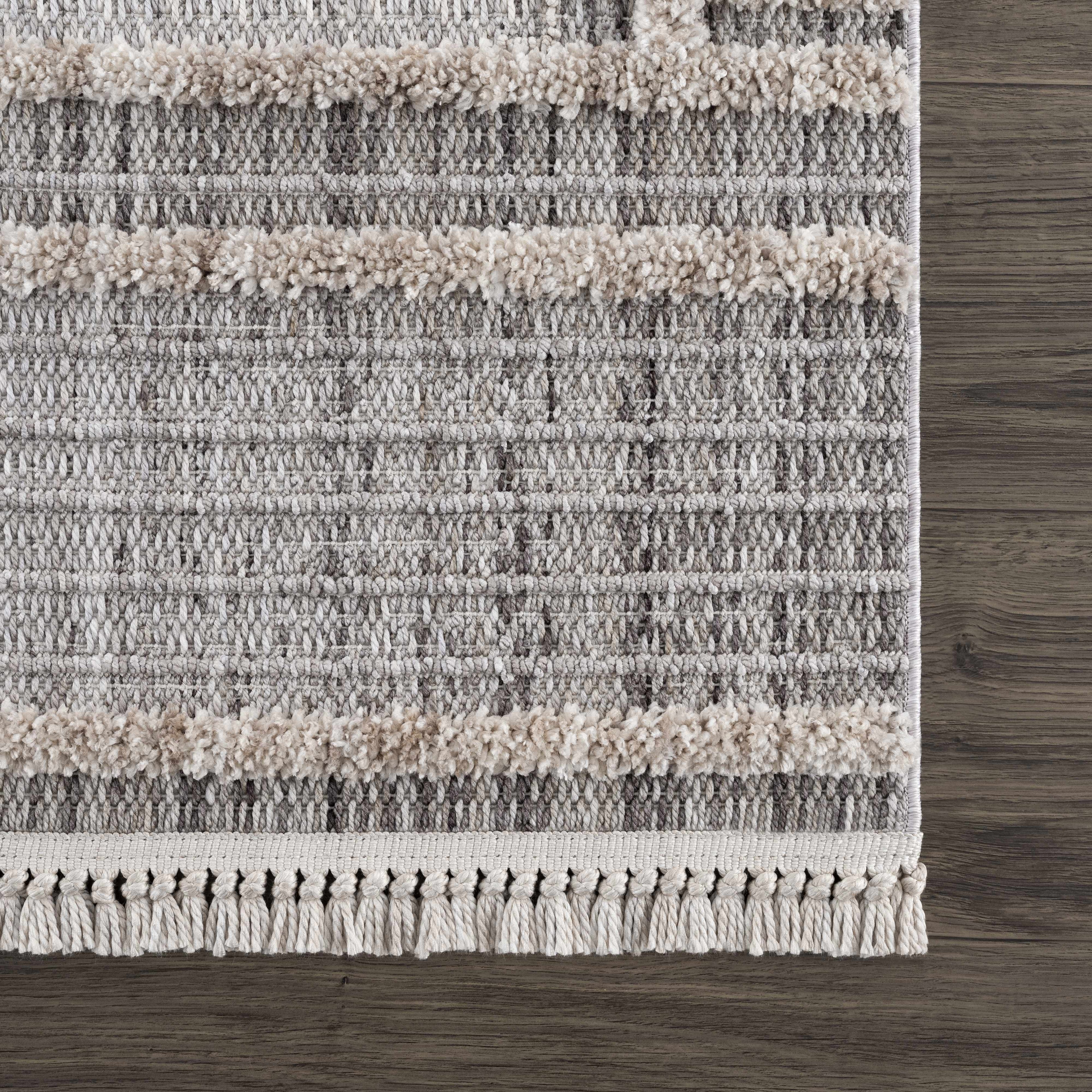 Textured area rug with striped pattern on a wooden floor
