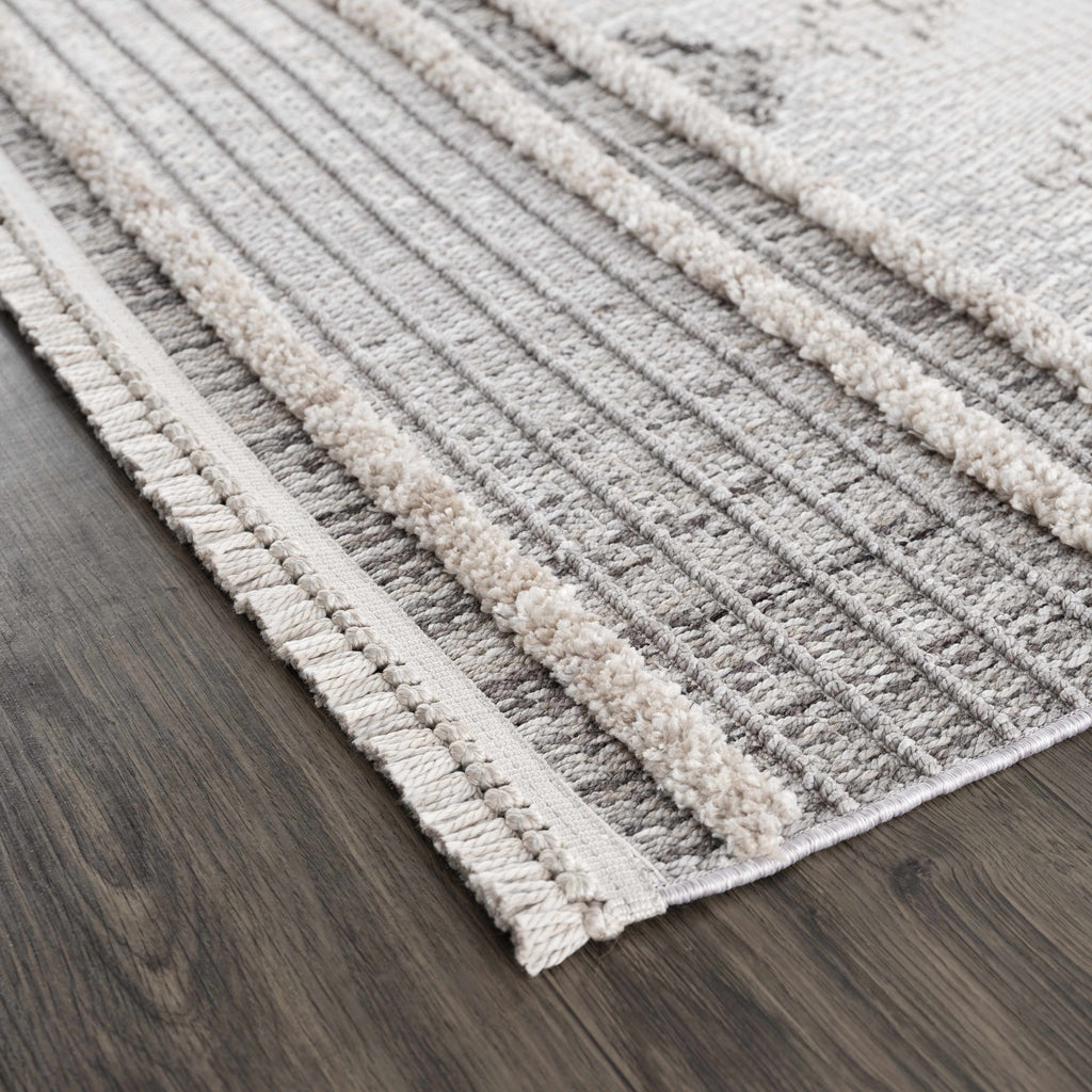 Textured area rug with striped pattern on a wooden floor