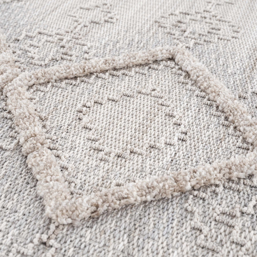 Textured beige rug with a subtle pattern