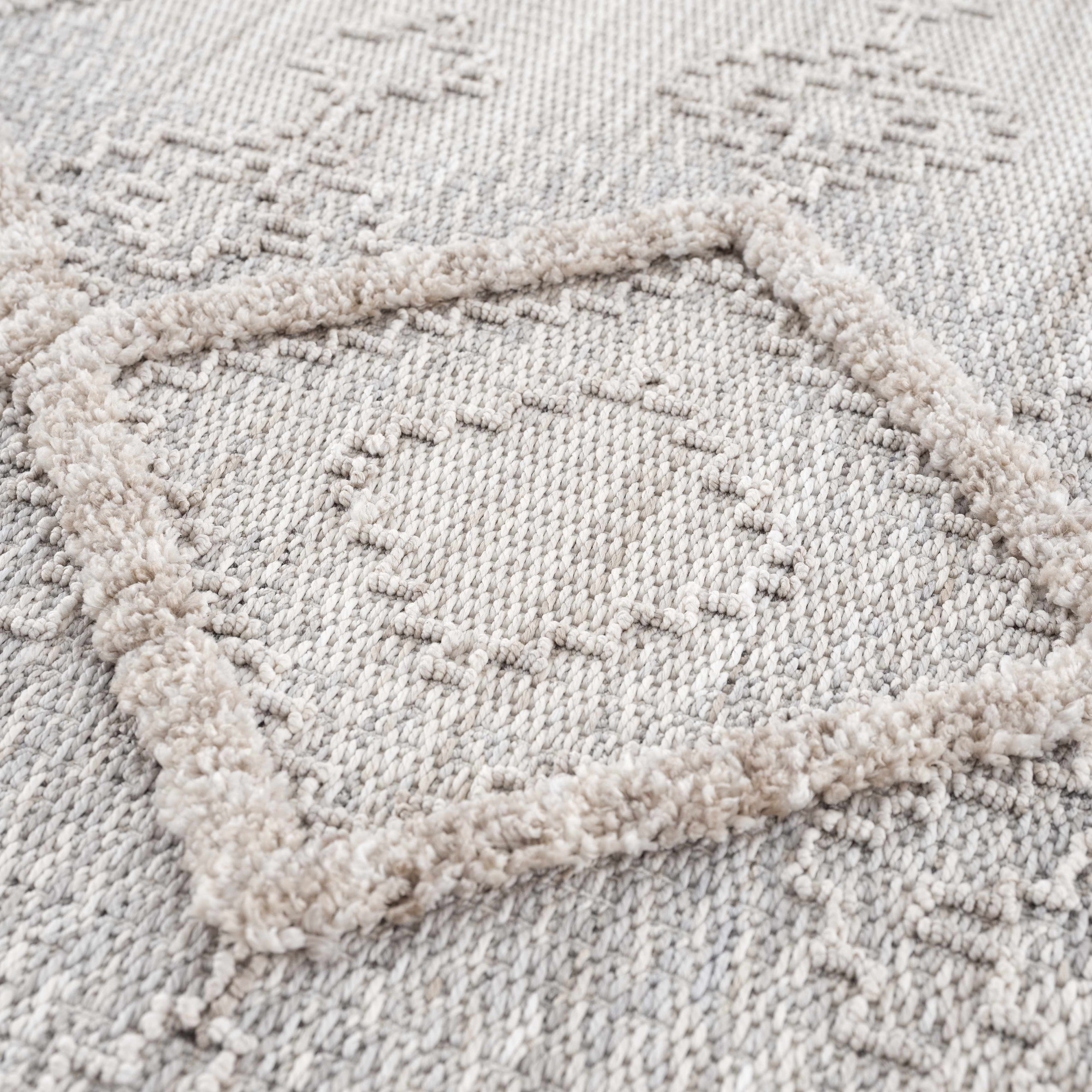 Textured beige rug with a subtle pattern