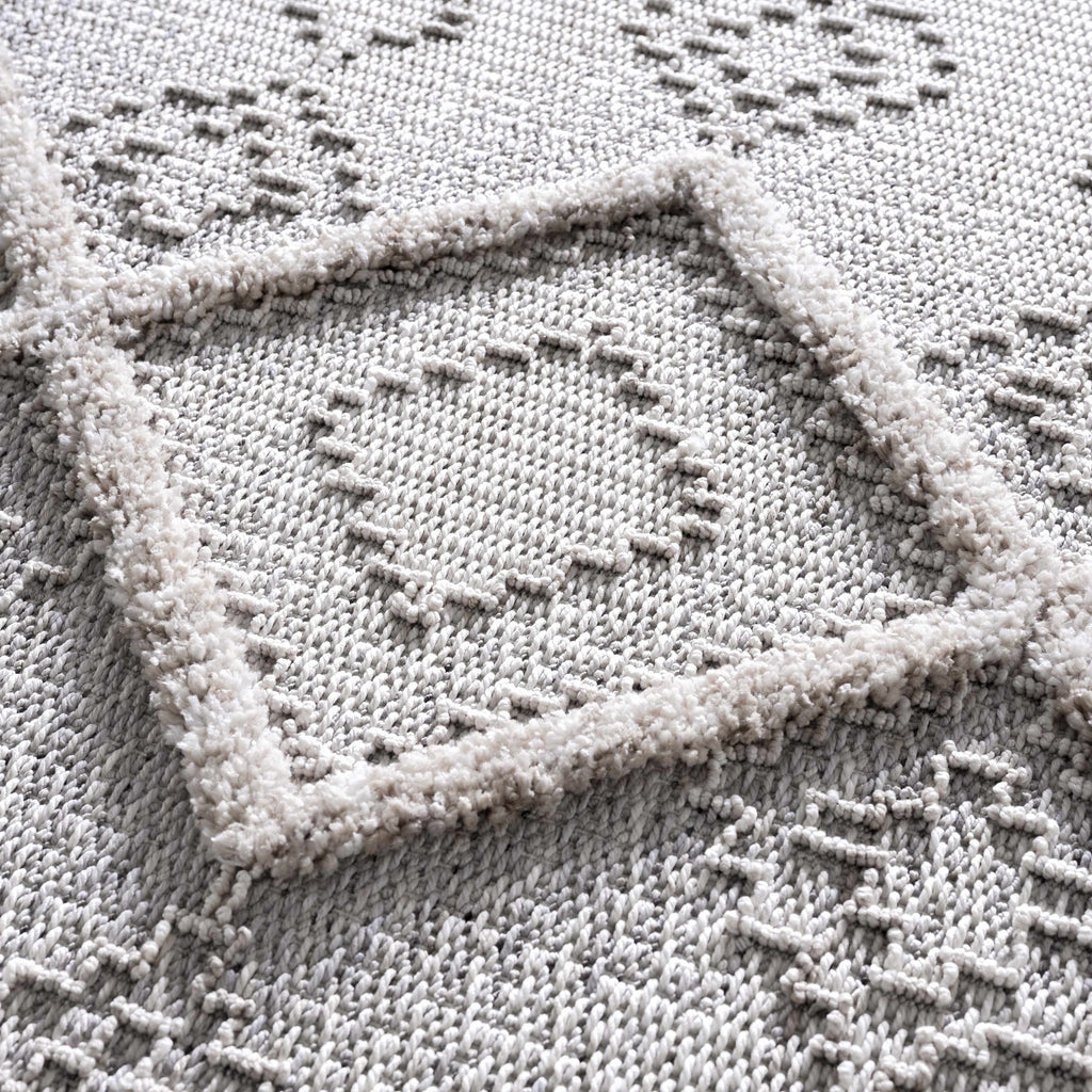 Close-up of a textured gray fabric with geometric patterns