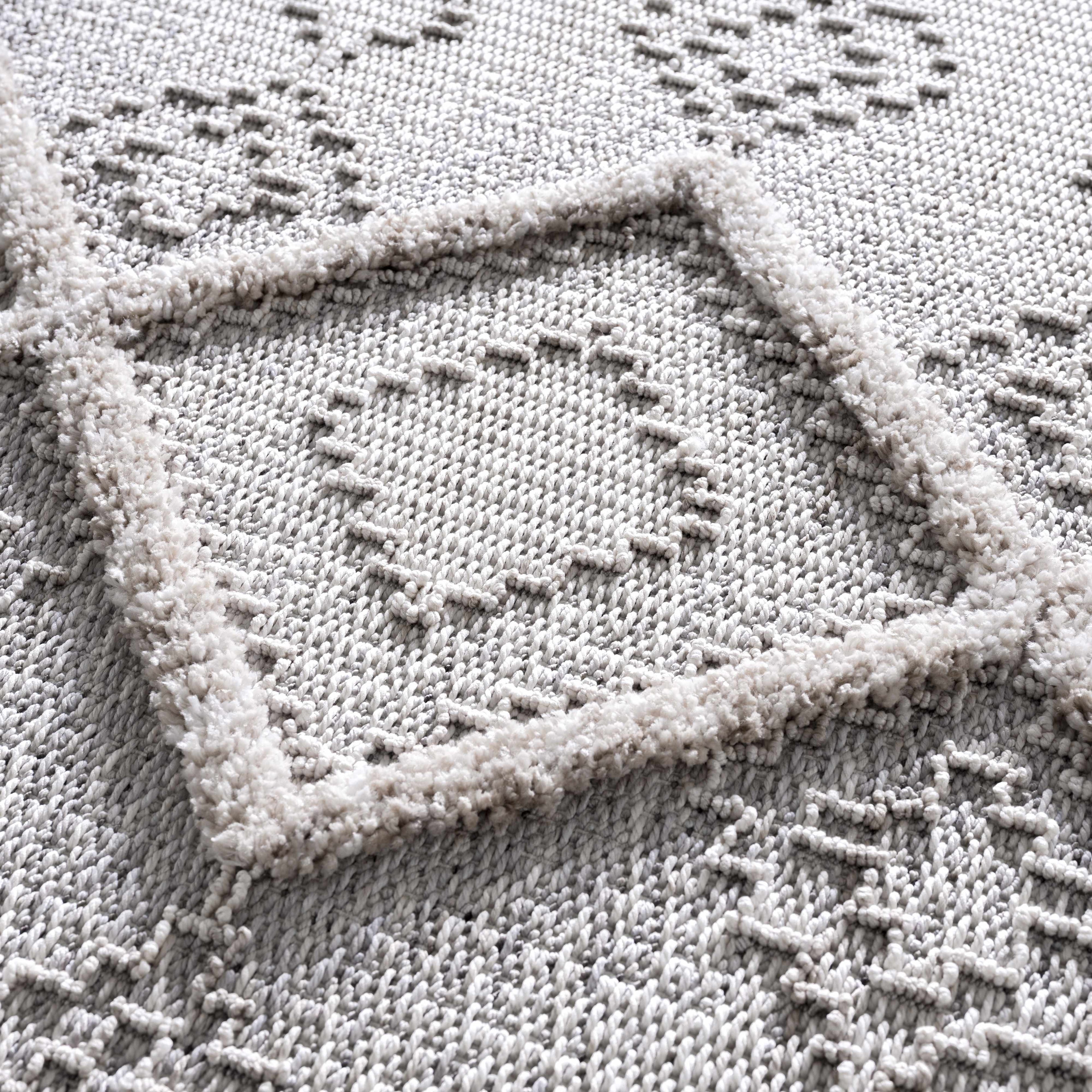 Close-up of a textured gray fabric with geometric patterns