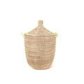 Woven basket with a lid on a white background