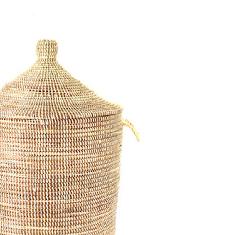 Woven beige basket on a white background