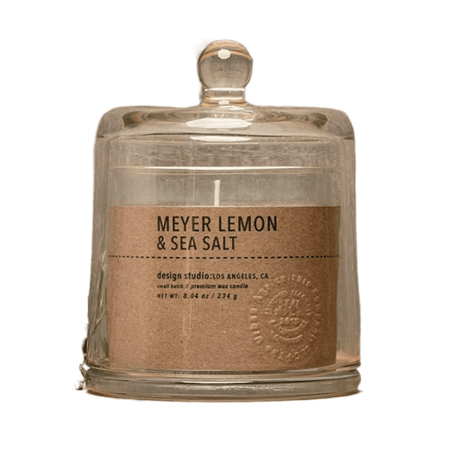 Candle jar labeled 'Meyer Lemon & Sea Salt' with a rustic design on a white background