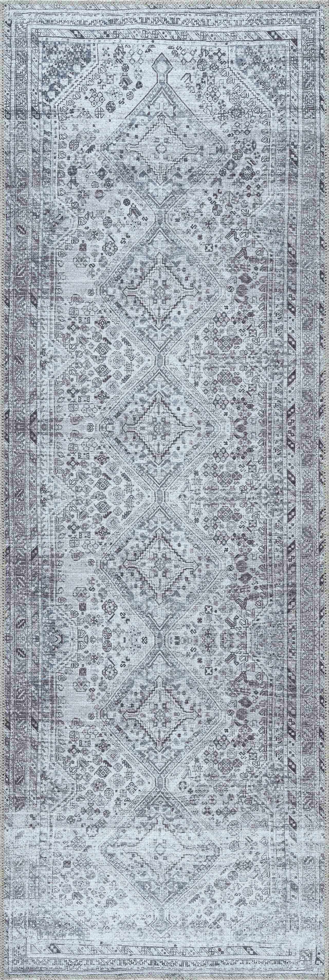 Patterned rug with geometric design in gray and white