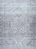 Patterned rug with geometric design in gray and white
