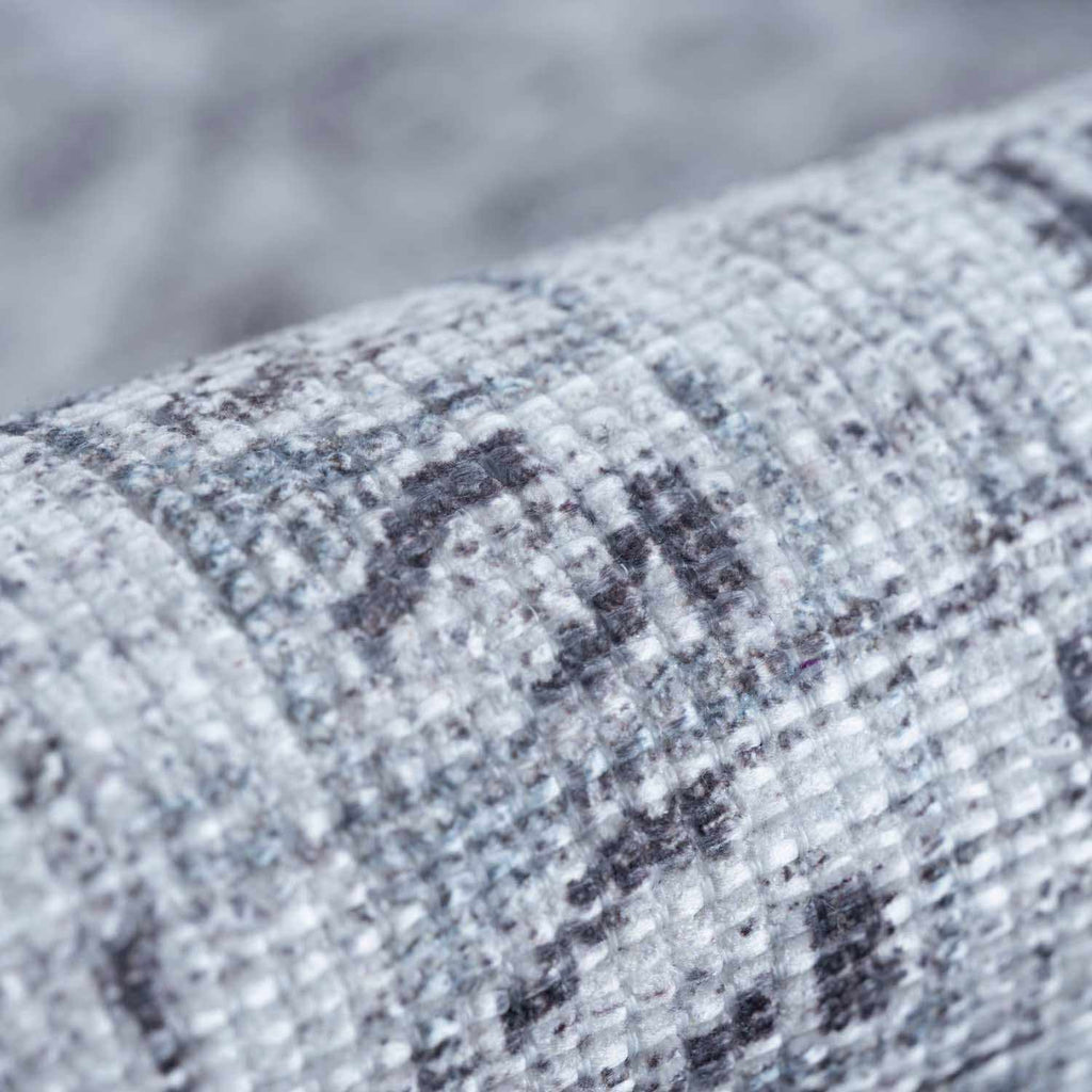 Close-up of a textured fabric with a pattern on a blurred background