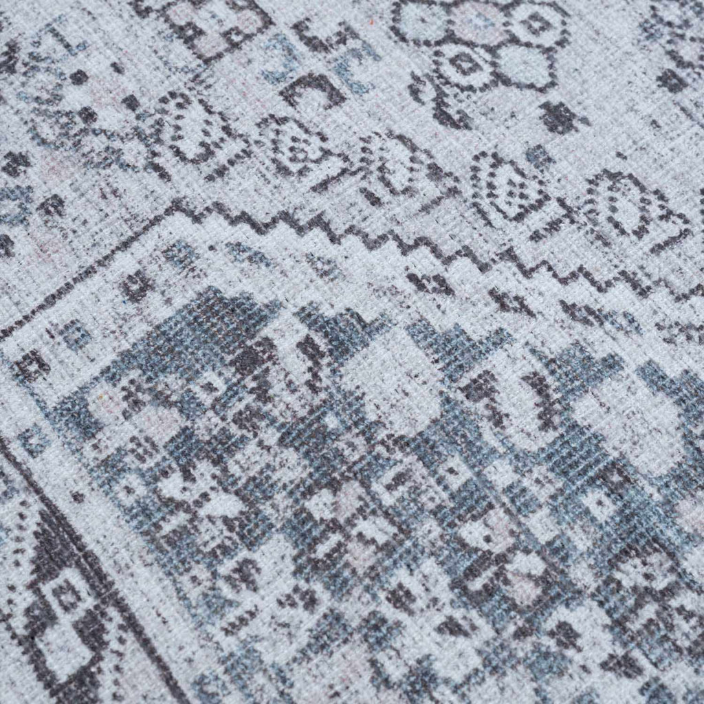 Close-up of a patterned rug with geometric design