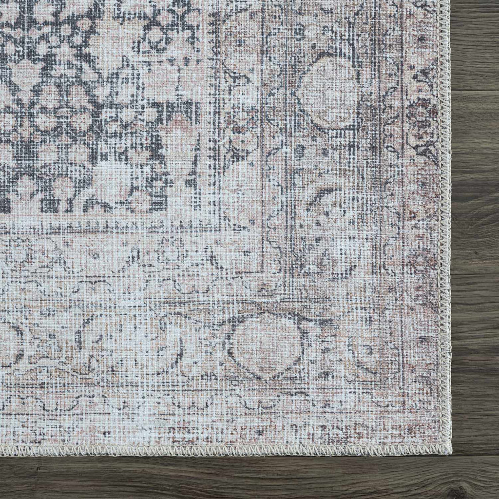 Patterned rug on a wooden floor