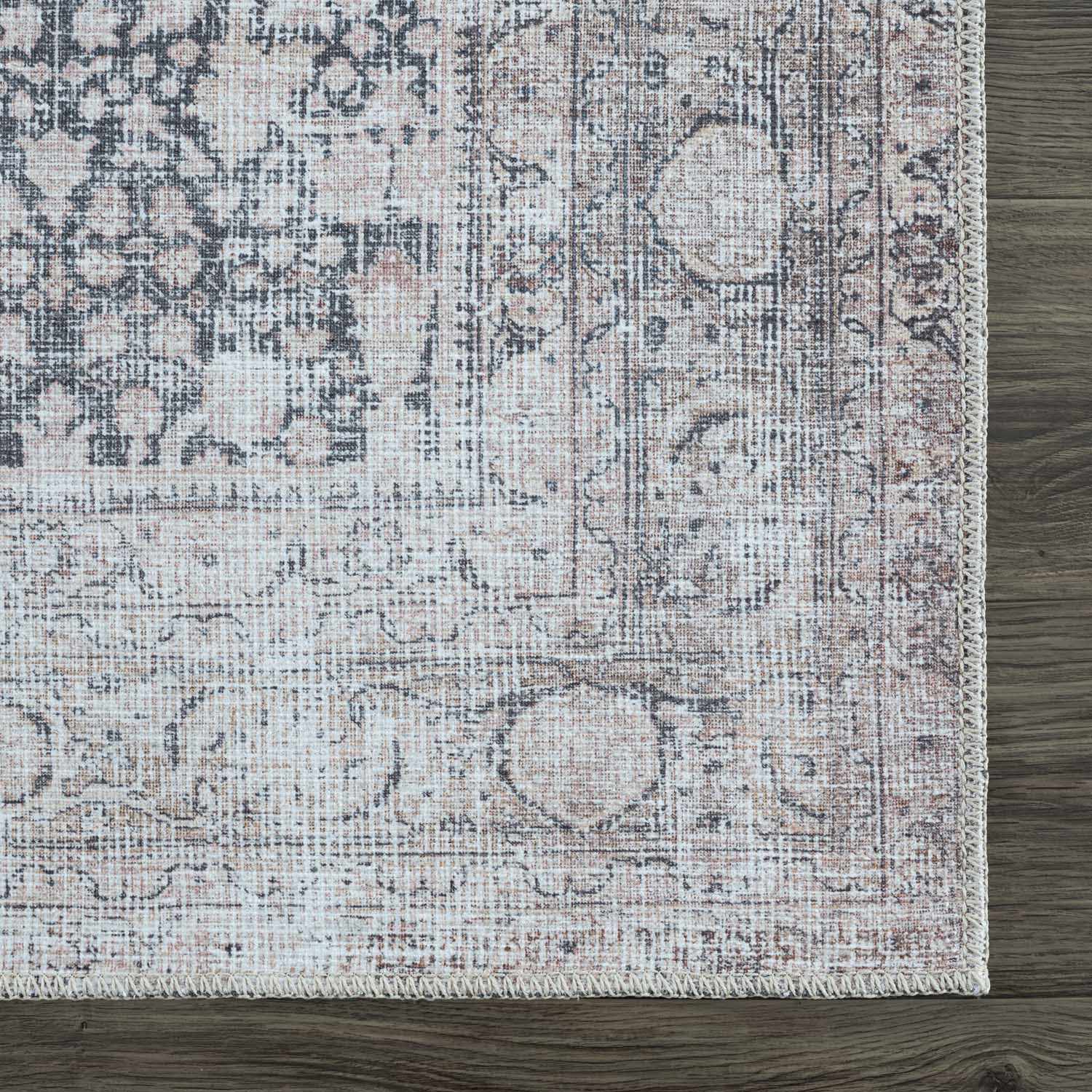 Patterned rug on a wooden floor