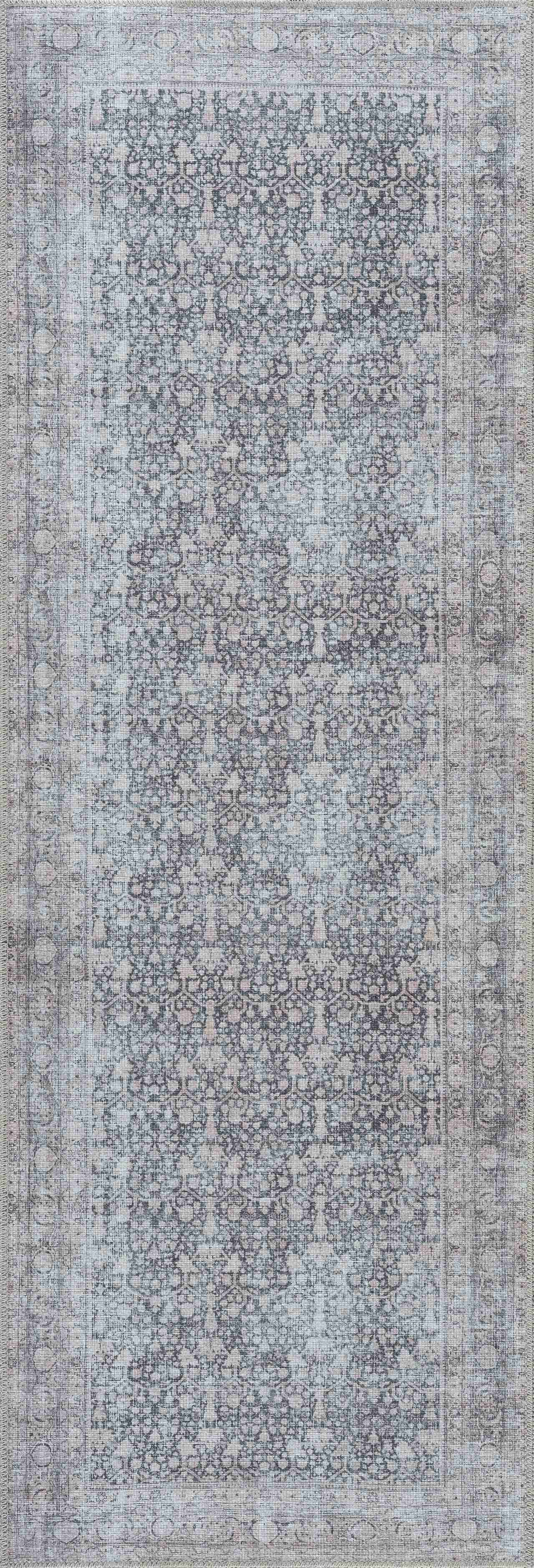 Long rectangular rug with a subtle pattern on a plain background