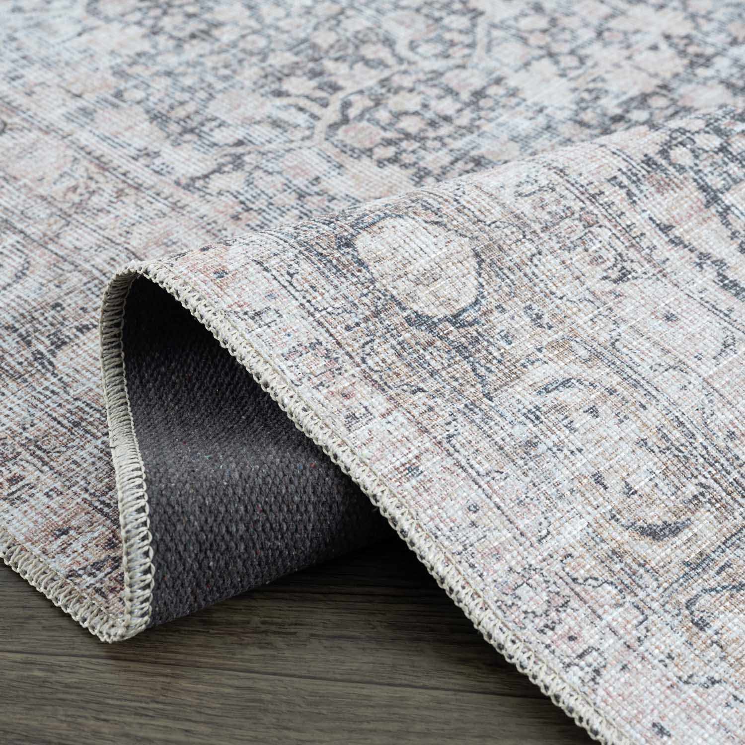 Textured area rug on a wooden floor