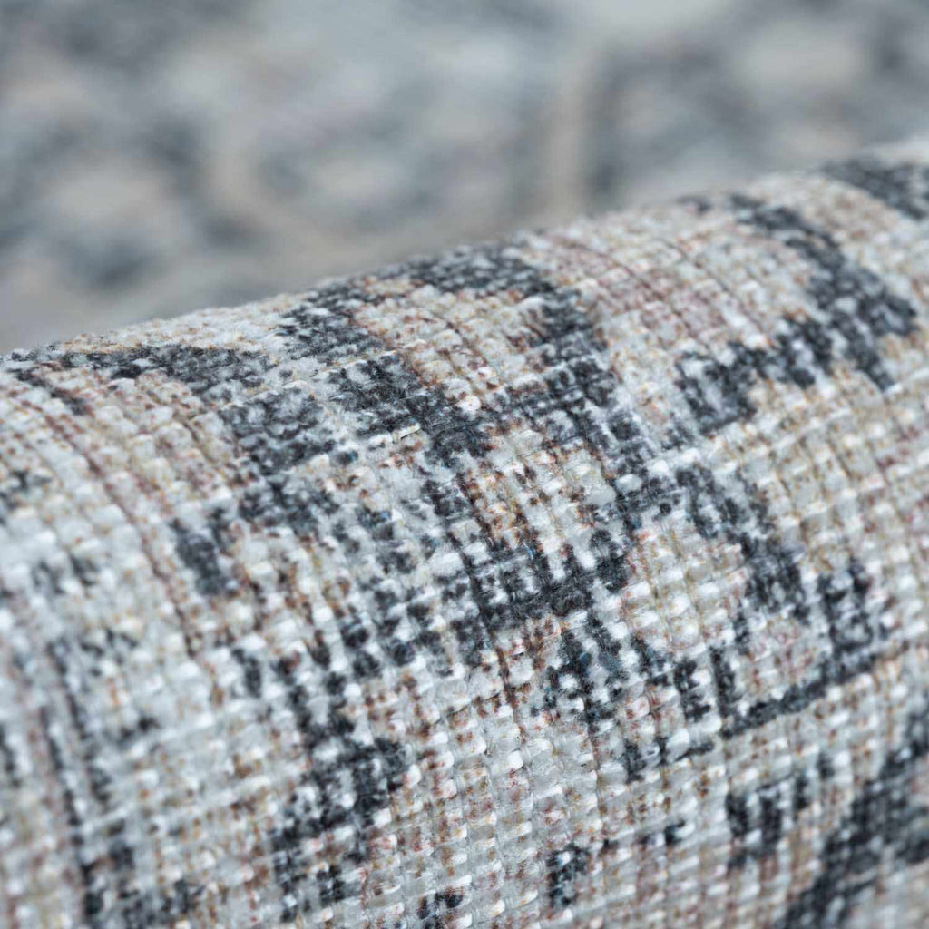 Close-up of textured fabric with a blurred natural background