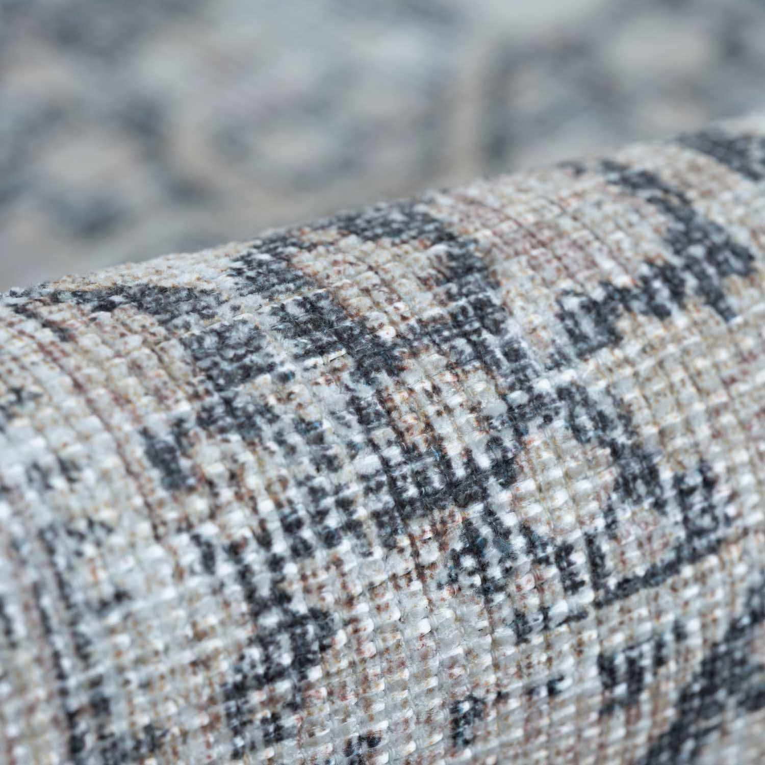 Close-up of textured fabric with a blurred natural background