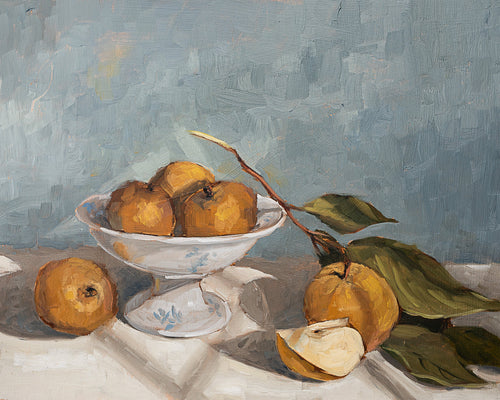 Asian Pears and Compote I fine art print featuring golden Asian pears arranged in a white pedestal compote with a sliced pear and leafy branch on soft linen. Rich painterly brushstrokes, warm earth tones, and a soft blue-gray background create timeless still life wall art for kitchens, dining rooms, and European-inspired interiors.