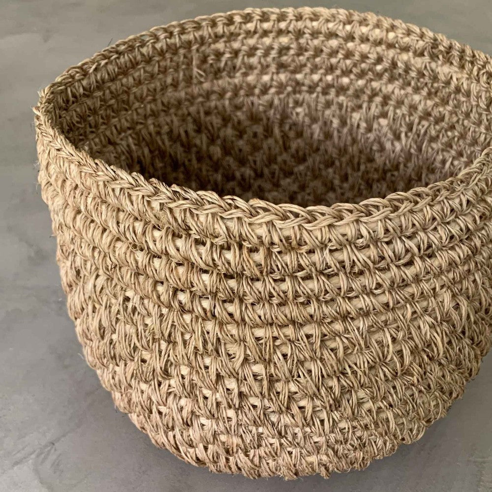 Handwoven natural bread basket made by artisans with woven natural fibers. Decorative serving basket for bread, pastries, fruit, countertop storage, and farmhouse or modern organic kitchen décor.