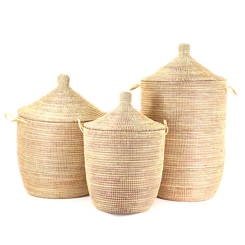 Three woven baskets with lids on a white background