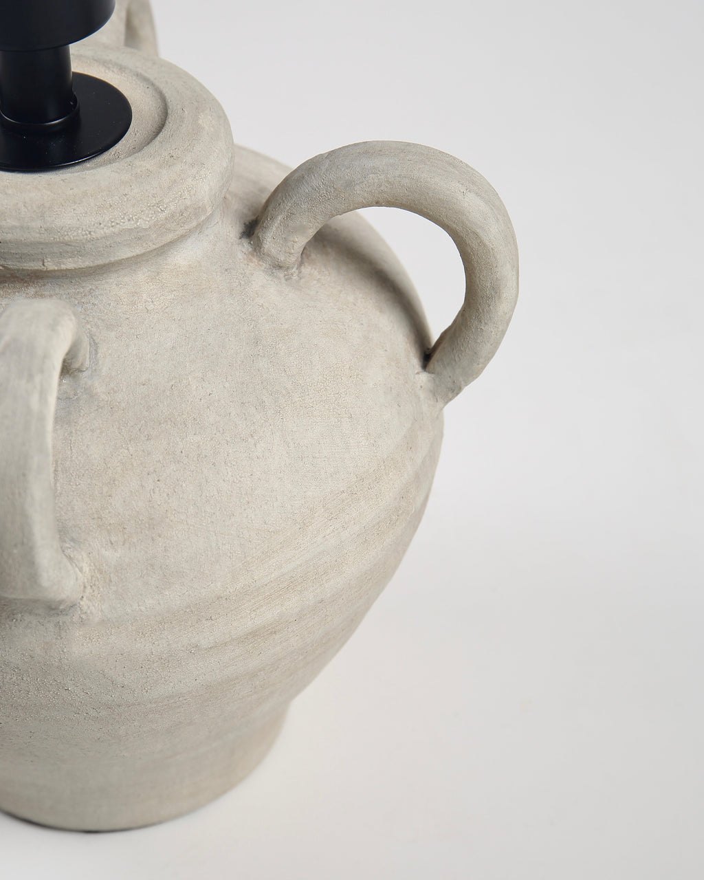Ceramic lamp with textured design on a white background