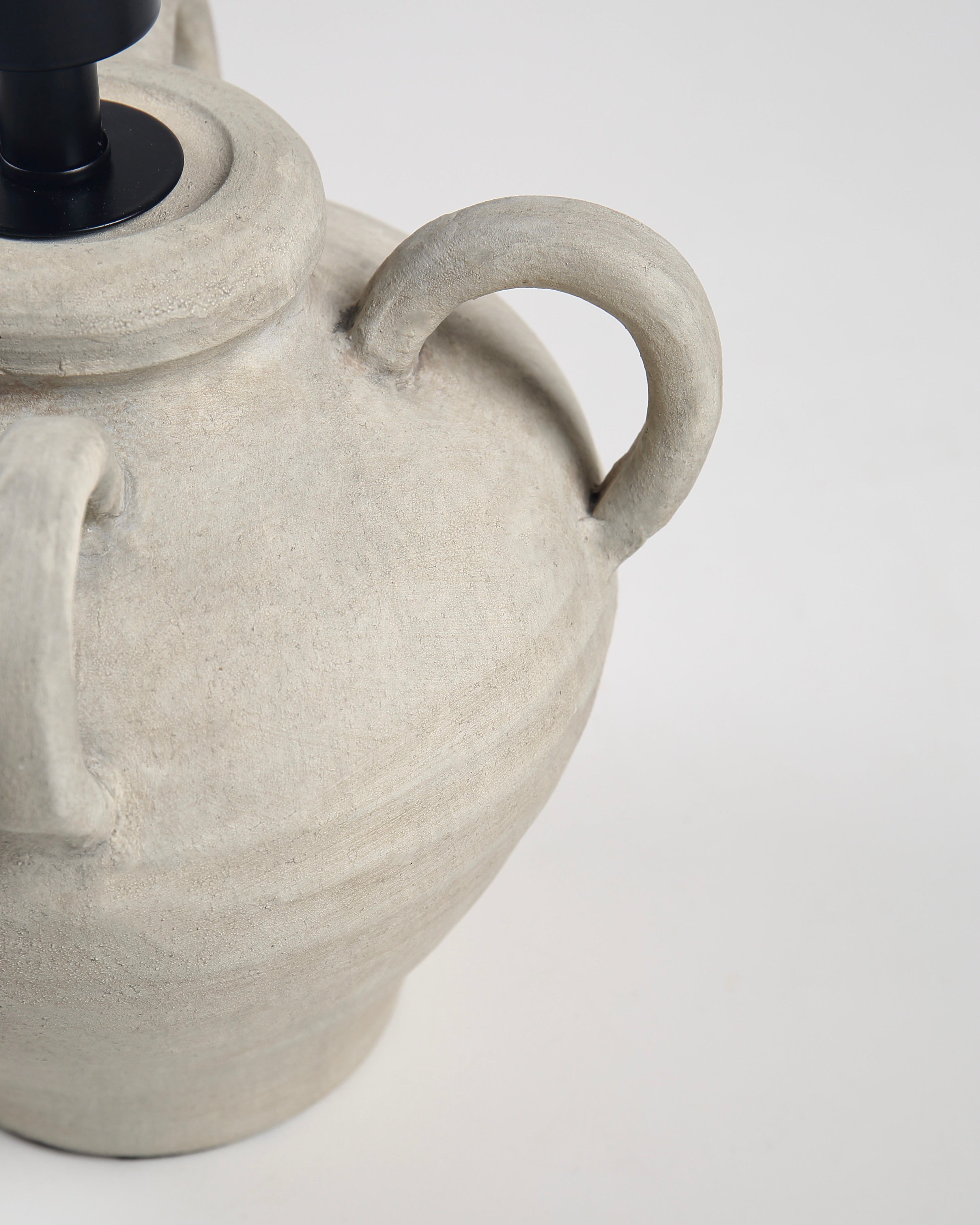 Ceramic lamp with textured design on a white background