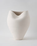 White ceramic vase on a light gray background
