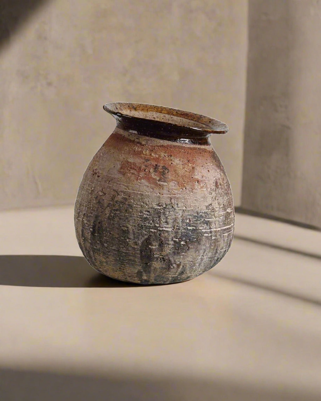 Vintage ceramic pot on a neutral background
