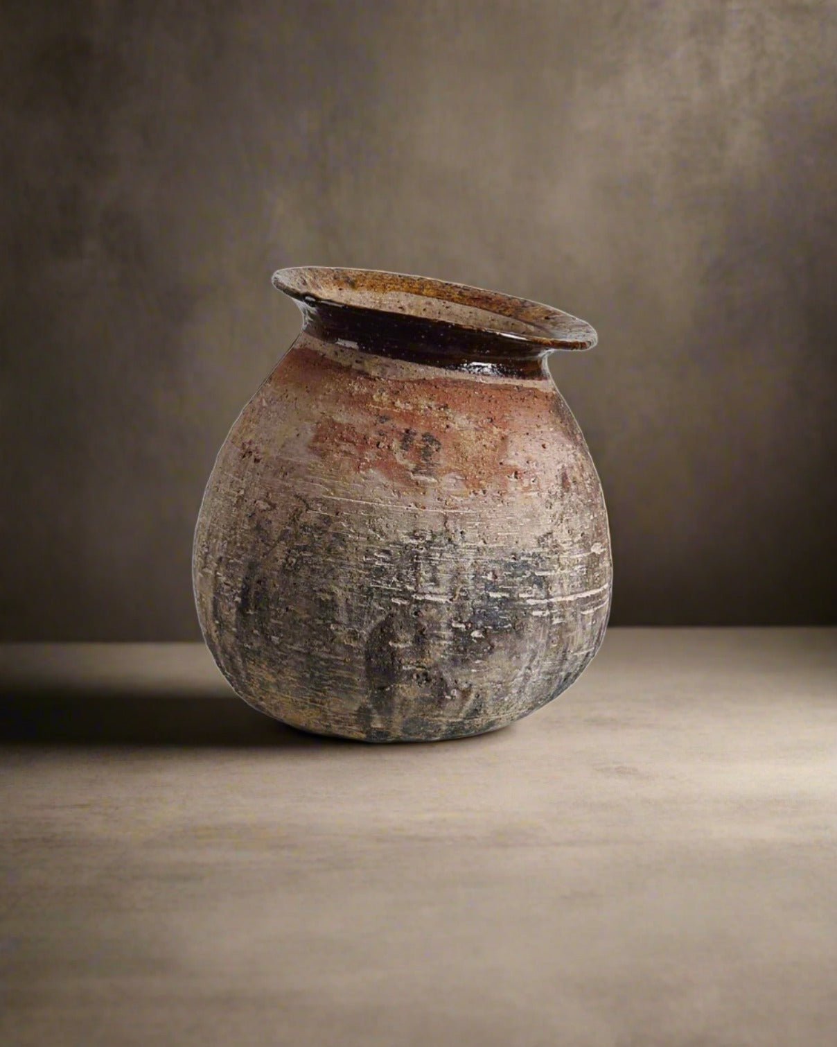 Vintage-style ceramic vase on a neutral background