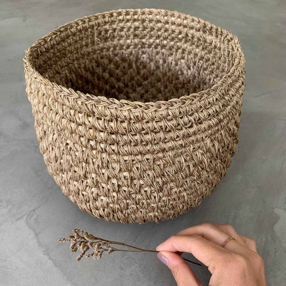 Handwoven natural bread basket made by artisans with woven natural fibers. Decorative serving basket for bread, pastries, fruit, countertop storage, and farmhouse or modern organic kitchen décor.
